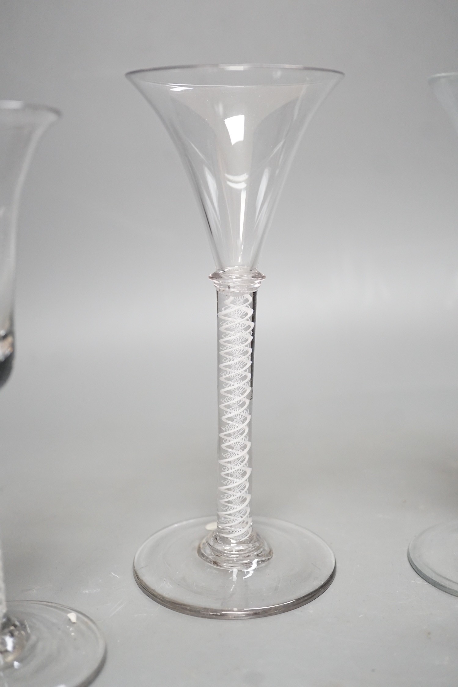 Three opaque or airtwist stem drinking glasses together with a Toddy lifter - 18cm high